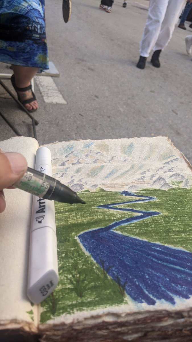 Using up some old #prismacolor and new #Arrtx markers. Random landscape is random. Enjoying the sun here at the Miami Book Fair in the Line by Lion Publications booth. What should I draw next? 
.
.
.
#Mbf40 #MiamiReads #miamibookfair #artinpublicplaces #naturalpaper #introvert