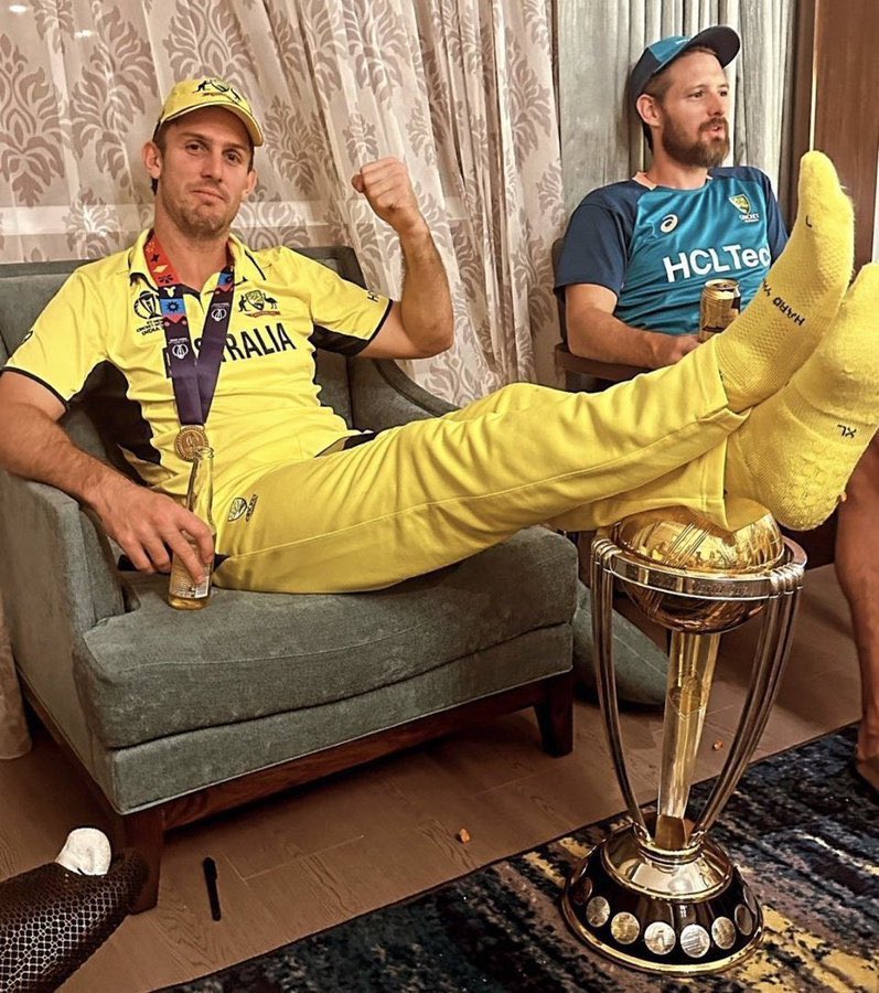 DrNimoYadav's tweet photo. This picture is speaking a lot.

You come to Bharat, reach finals, play the final in world’s biggest stadium in front of 1.3 Lakh Bhartiya along with Bhartiya prime minister & other political leaders.

You win a one sided game, stuns the crowd and take the trophy.

You pose with your legs on the trophy after winning the WC.

It seems marsh is saying this is not trophy, this is toxic Bhartiya cricket fans who tried to silence us in Bharat but wasn’t able to.

And do you know why it all happened? 

Because one politician wanted to host the final in his home state just to satisfy his ego.
