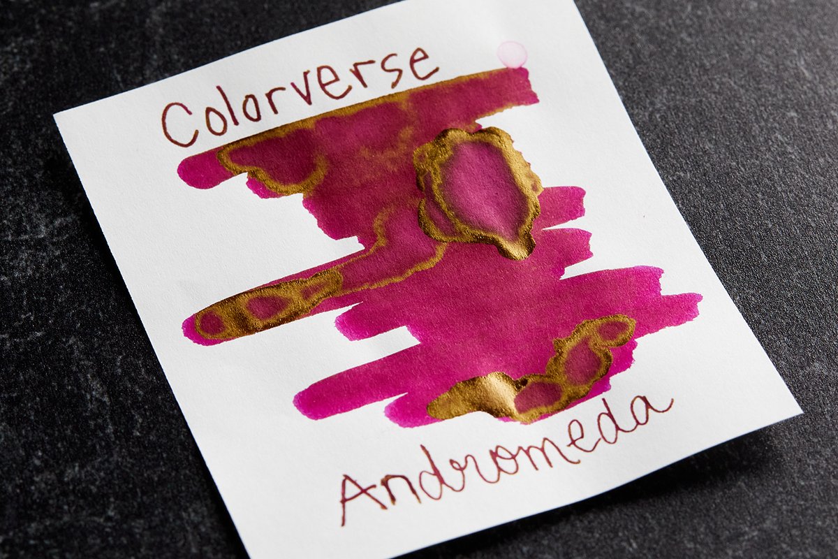 Colorverse Andromeda is a captivating blend of warm fuchsia ink with delicate pink undertones and golden sheen.

Elevate your writing experience with an ink that flows effortlessly on paper, bringing a burst of flair to every word you put down. shop.gouletpens.com/3G9373e
