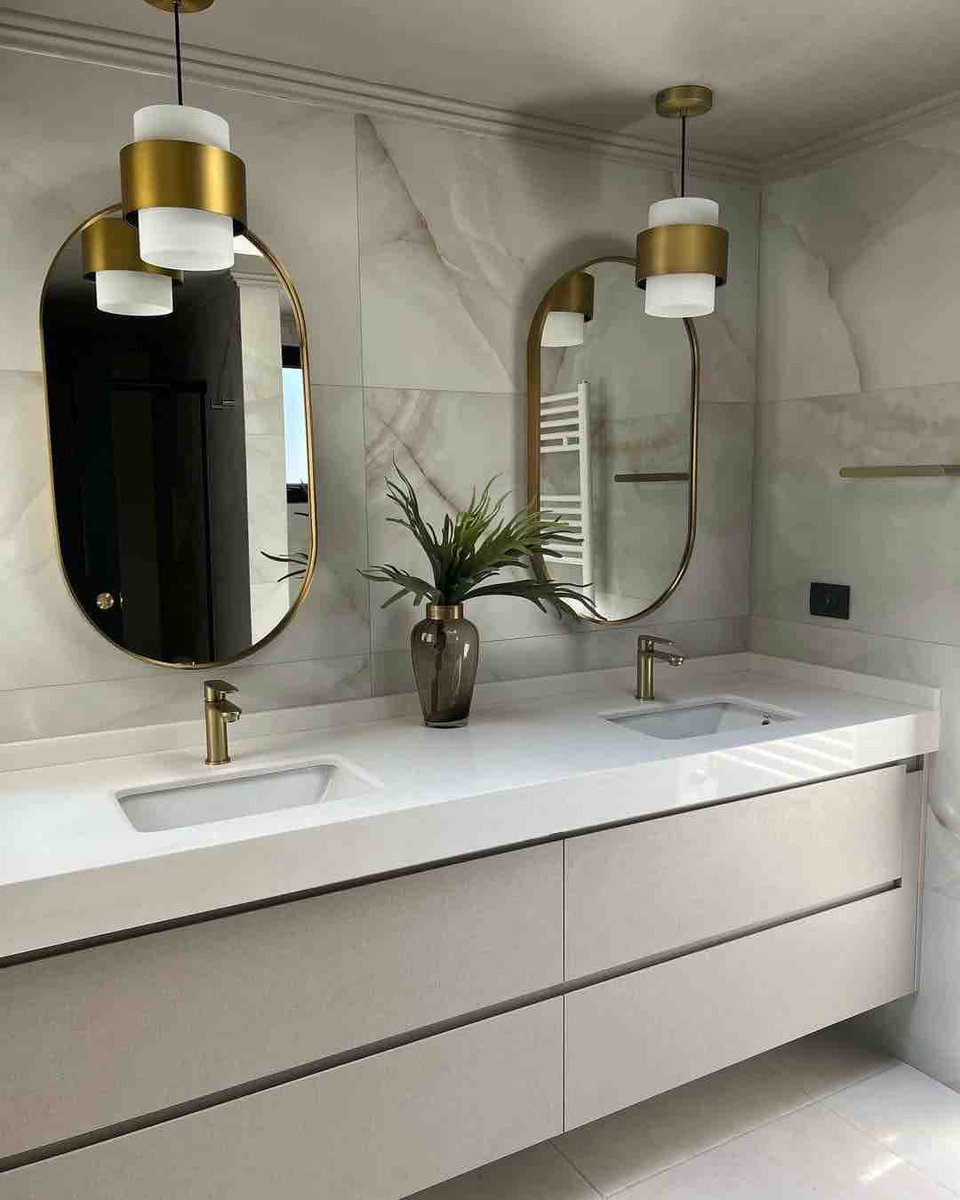 ProBuiltBuilder's tweet image. Elevate your daily rituals with opulent charm. Twin sinks adorned in gold accents, framed by lush greenery—an oasis of sophistication. #bathroomremodel #inspopicture