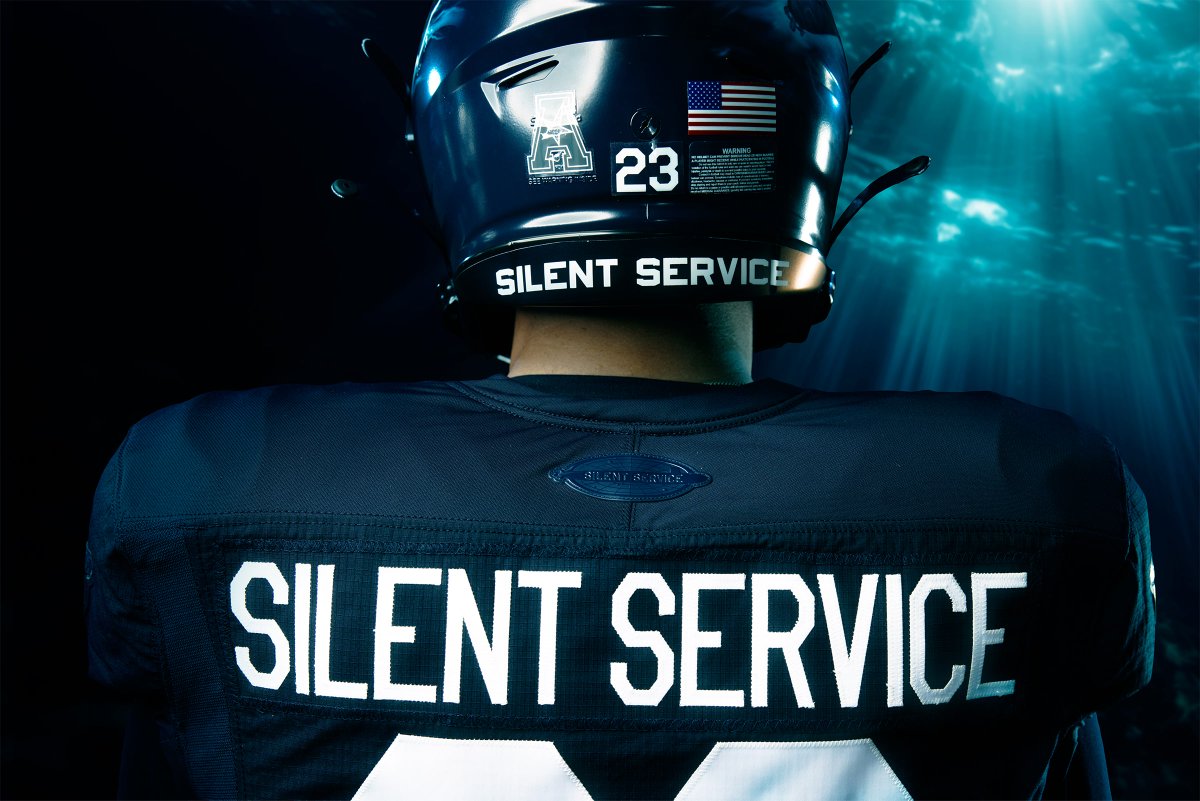 NavalInstitute's tweet photo. Navy Athletics has unveiled its sub-themed "Silent Service" football uniform for the Army-Navy Game being played on Dec. 9. The uniform's color is Elipse Navy, and the helmet features an image of a Virginia-class submarine. A jersey patch will honor USS Massachusetts (SSN 798). https://t.co/1wUbNnJa7e