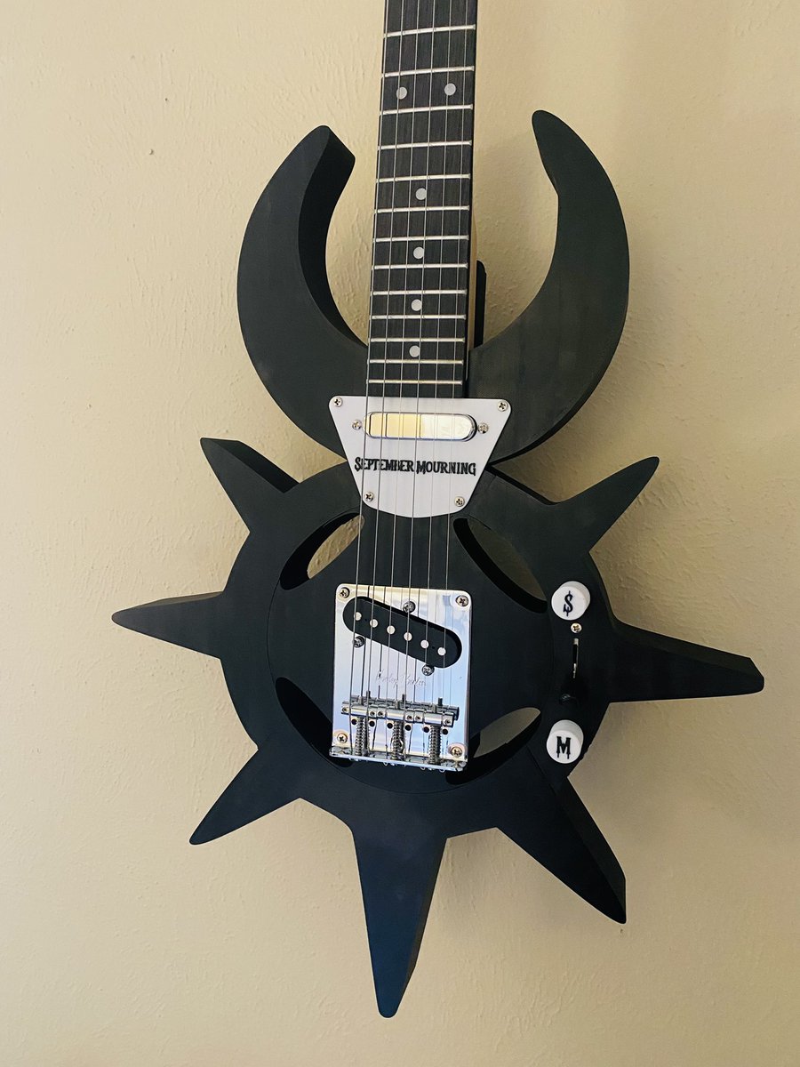 Ben_Varn's tweet photo. Wanted to 3D print a unique guitar. @SeptmbrMourning logo seemed like a good fit to model. It’s a crazy and cool guitar. Still trying to figure out where to put the strap buttons lol. https://t.co/cGw6eKtas2
