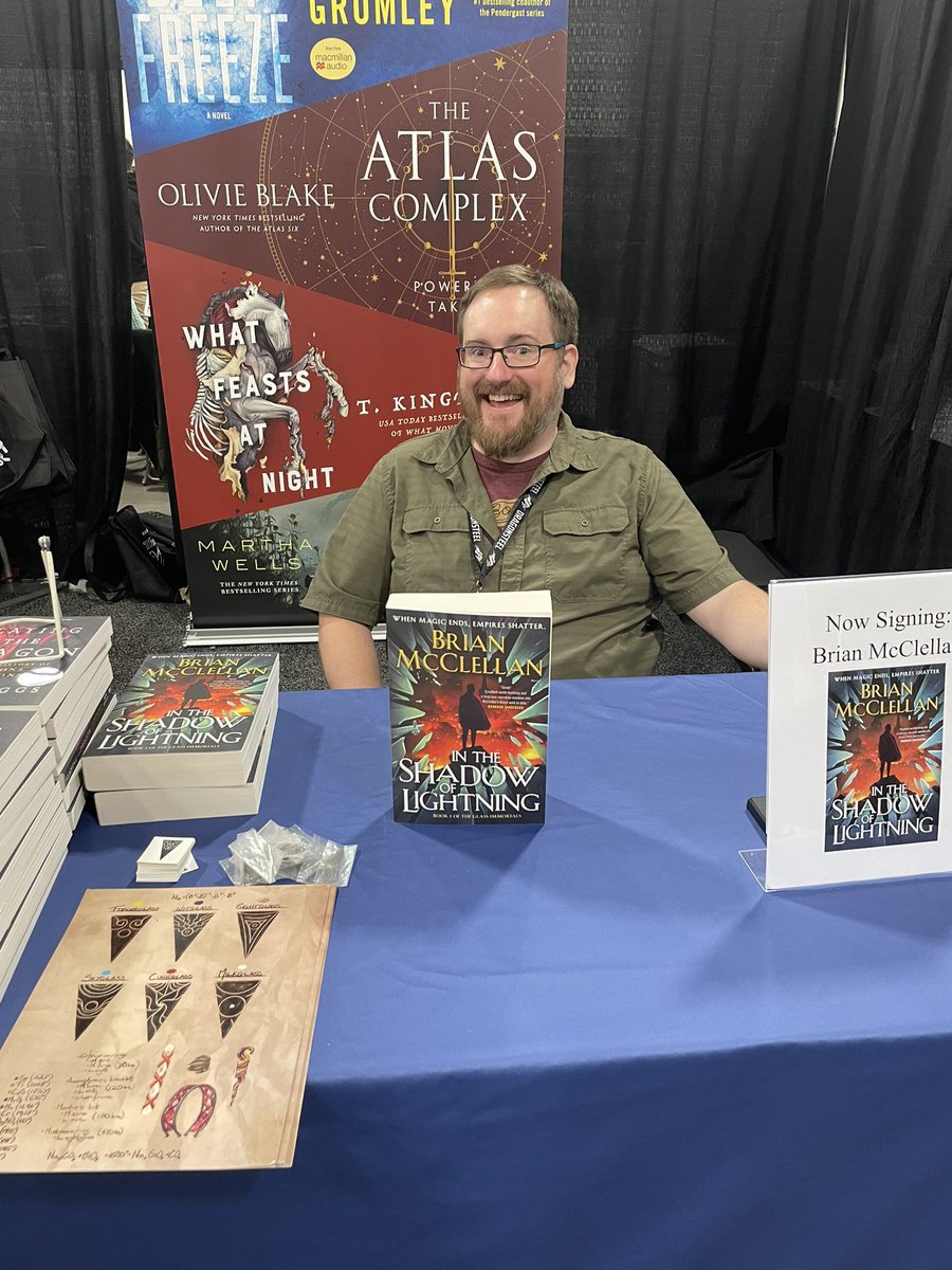 torbooks's tweet photo. @BenRiggs_ @StMartinsPress We’re so excited that @BrianTMcClellan is at Booth #301 signing copies of #InTheShadowofLightning!!! Stop by for a signed book and some free swag 🥰 https://t.co/QgmqMJfEpH
