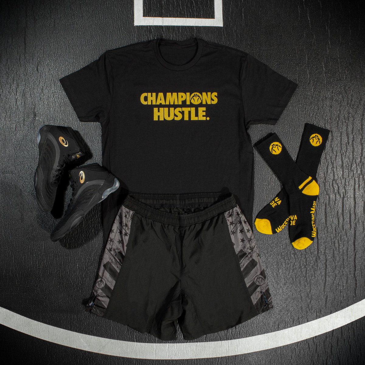 Champions Hustle. Champions Also look good. :) 

All gear available now at WrestlingMart.com