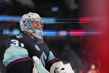 Photo of Philipp Grubauer smiling during warmups