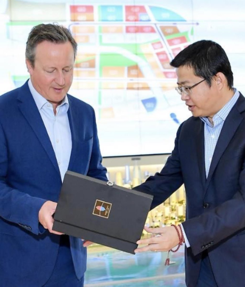 Source gets in touch to say gift was a souvenir glass of Port City sand This was reclaimed during China’s draining of the site, part of Xi’s Belt & Road initiative Chinese developer — part of entity sanctioned by the US — gives them to VIPs Cameron had denied contact with them