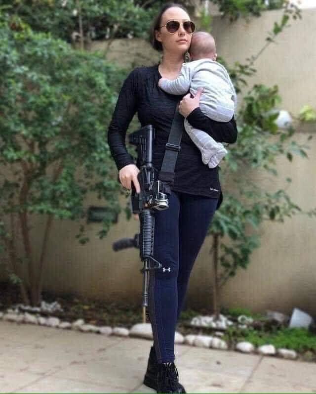 Only in Israel 🇮🇱
A woman. A mother. A warrior. 
She’s a superwoman! 

Photo: Khalil Rohana