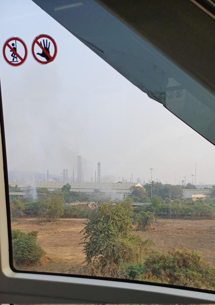 A snapshot of Mumbai's air pollution from the monorail: garbage burning ahead of Mysore colony