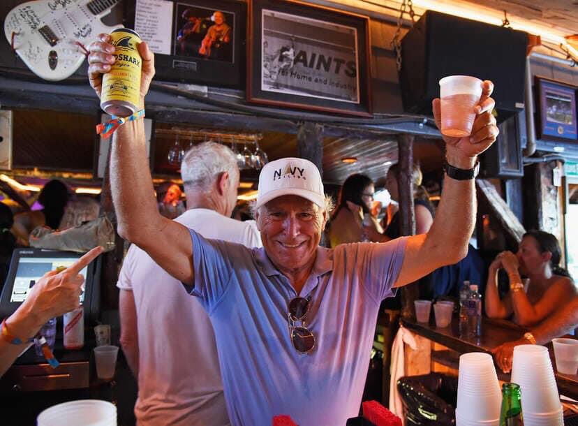 Lately, newspaper mentioned cheap airfare
I've got to fly to Saint Somewhere
I'm close to bodily harm

20 degress and the hockey game's on
Nobody cares, they are way too far gone
Screamin', "Boat drinks"
Somethin' to keep them all warm