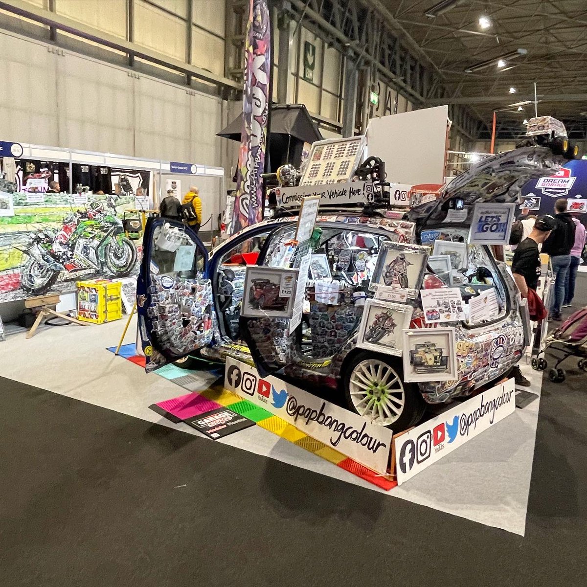 Popbangcolour's tweet photo. The @popbangcolour stand adding a splash of colour to hall 3 @motorcyclelive this week,

The @asecustommc x PBC #Paintwithcars custom BMW K100 on display too. 🏍️+🎨

Prints &amp; merch available on the https://t.co/zcoBbhNaMN 

#MotorcycleLive #motorcyclelive2023 https://t.co/cyhyMy9rny