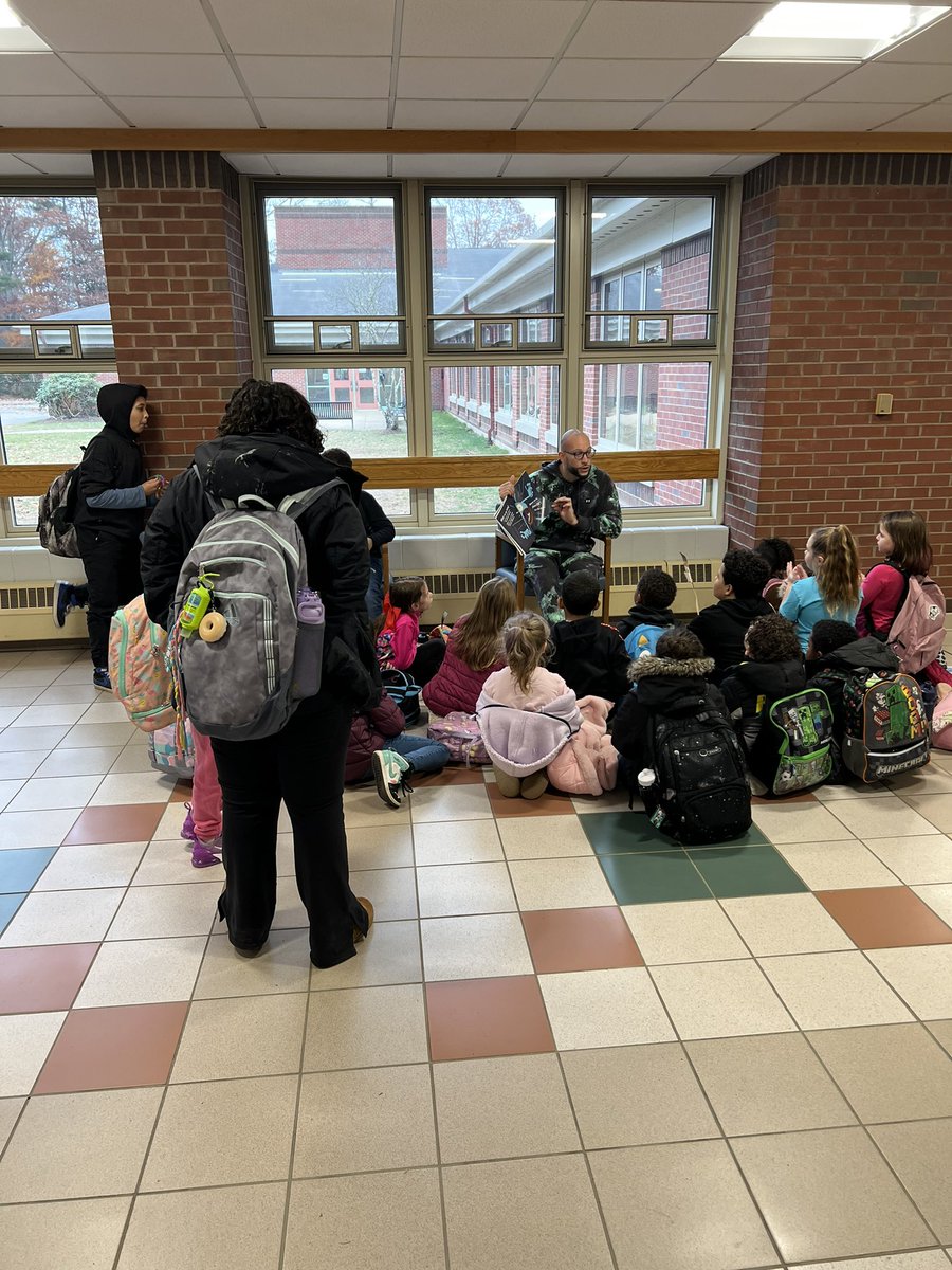 Kindness is…Mr. Lane entertaining students with a read aloud while waiting for the bus! 💛