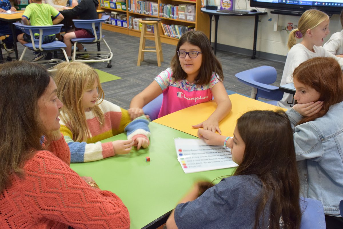 Elementary librarian Meg Hoon read Peter Reynolds’ “Our Table” to a fourth grade class. After reading the story, she gave students a gratitude game that she created with questions about a person, place, thing, food or friend that each student was grateful for. #PortJeffProud