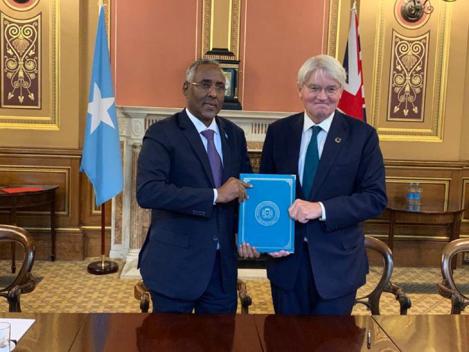 Somalia and the UK have solidified a collaborative agreement, formalized by 🇸🇴  Minister of Foreign Affairs, <a href="/abshirhuruse/">Abshir Omar Jama (Huruse)</a>, and the UK’s Minister of State for Development and Africa, <a href="/AndrewmitchMP/">Andrew Mitchell</a>. This event signifies a crucial milestone in the diplomatic ties between 🇸🇴 and 🇬🇧