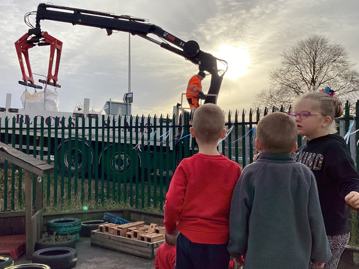 Lots of interest today as a delivery of top soil arrived for our community garden. A small group of children were fascinated by the workings of the lorry. 'That's a grabber, watch this, it grabs' L 'It lifts things up high' H 'It's massive' L