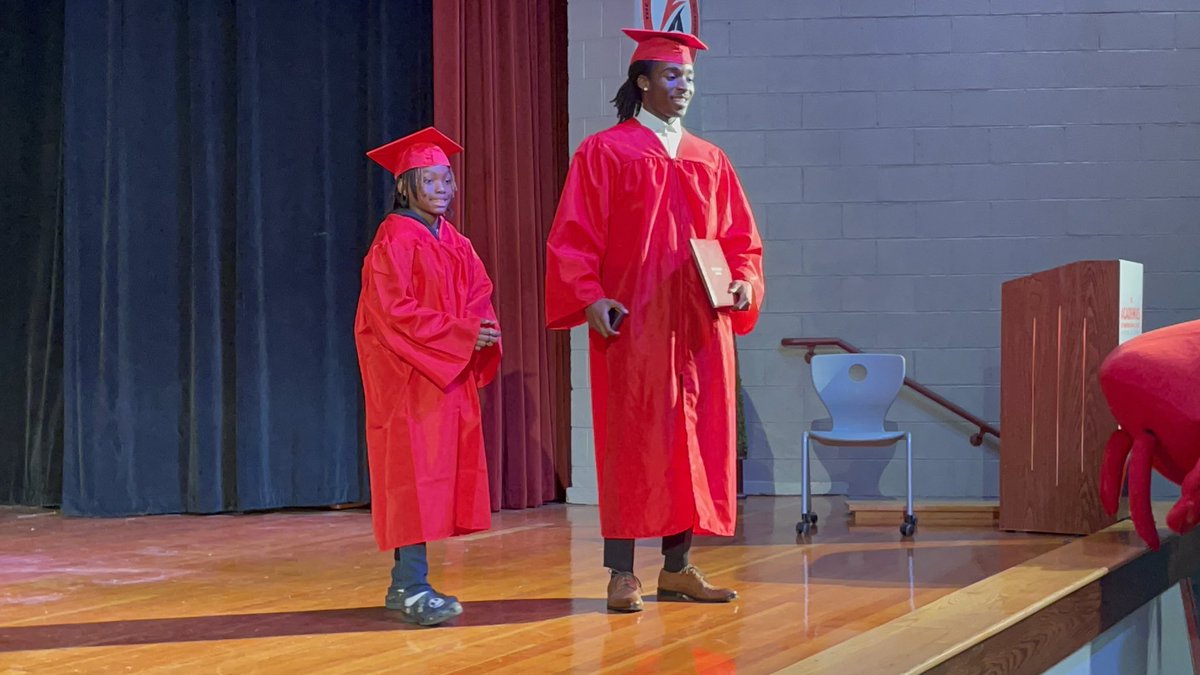 EL_Williams4's tweet photo. Our 5th Grade Rockets got a glimpse at their future today! Senior Crabber, Isaac handed 5th grade Rocket, Phantom his Crabber Diploma. We learned how to embody the portrait of a Hampton Graduate. 🚀🦀 https://t.co/UOngENr0bp