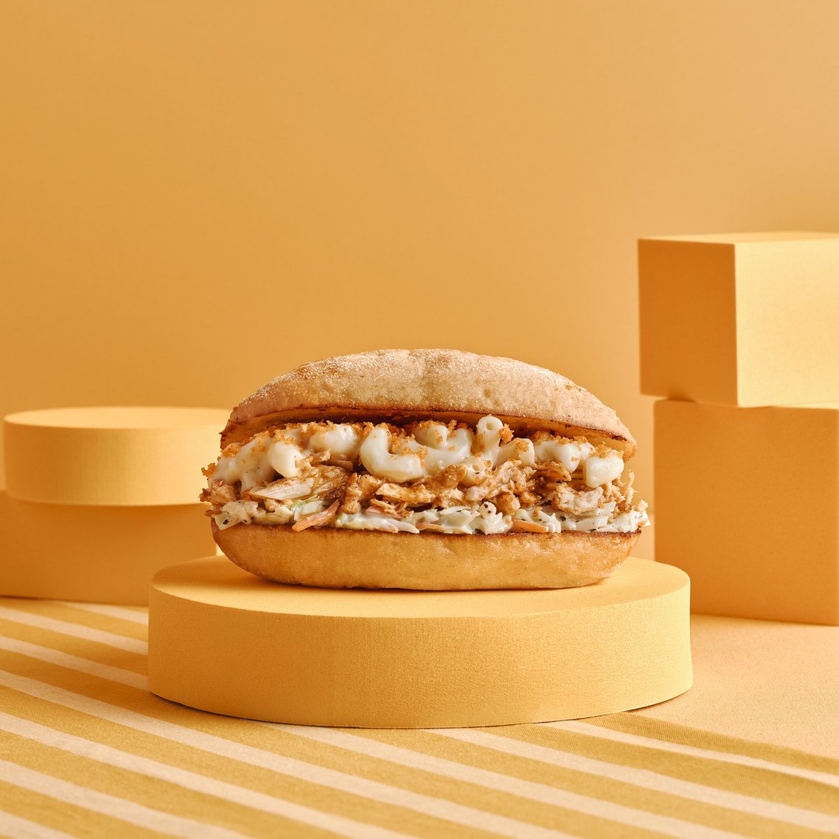 The sandwich of your wildest dreams with the sides ✨ inside ✨.
 
PERi-PERi pulled chicken, house-made coleslaw, four-cheese PERi Mac, and a drizzle of PERi Honey sandwiched between our buttery garlic bread. 
 
Try the PERi Mac Stack today!