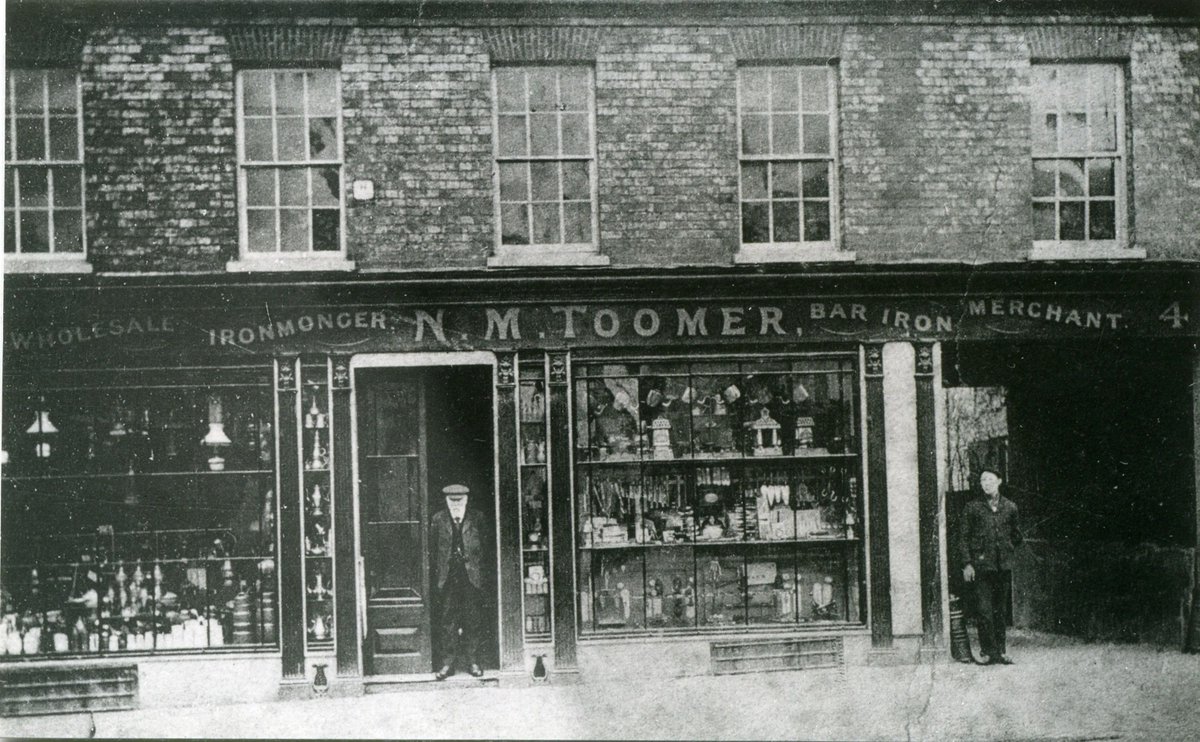 WBerksMuseum's tweet photo. The House of Toomer started as a small ironmonger’s shop in Newbury Market Place in the 1800s, moving to Northbrook Street &amp; finally, as seen in the painting by Jack Barnes, to Bartholomew Street before closing in 1996. Images copyright West Berkshire Museum. #Toomers #Newbury https://t.co/qQAqSBS1S1