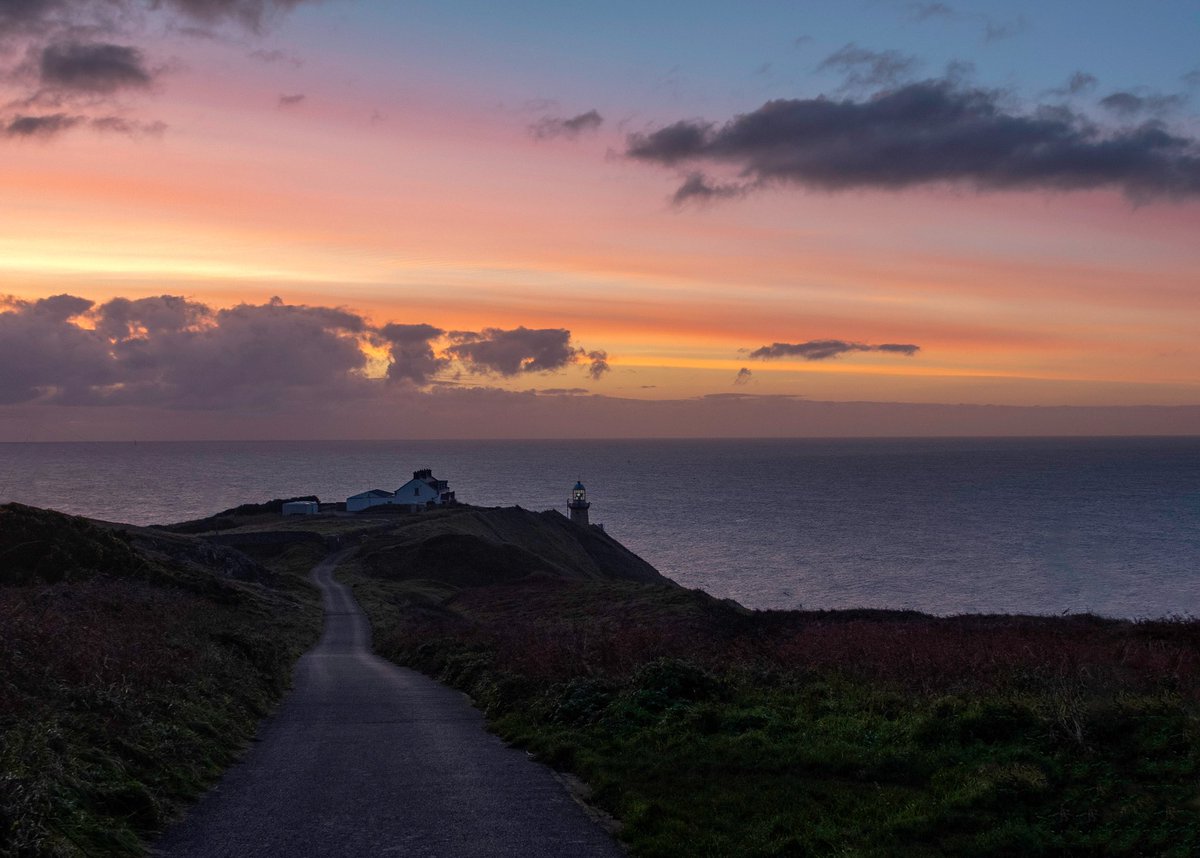 AnnBruen's tweet photo. Go n-รฉirรญ an bรณthar leat / May the road rise to meet you. The road down to the Baily Lighthouse on the Howth Peninsula against some beautiful sunrise colours yesterday morning.
@IrishCentral @VisitDublin @LovinDublin @HowthTidyTowns @discoverirl @LoveFingalDub @ThePhotoHour https://t.co/yRmgSyT4nc