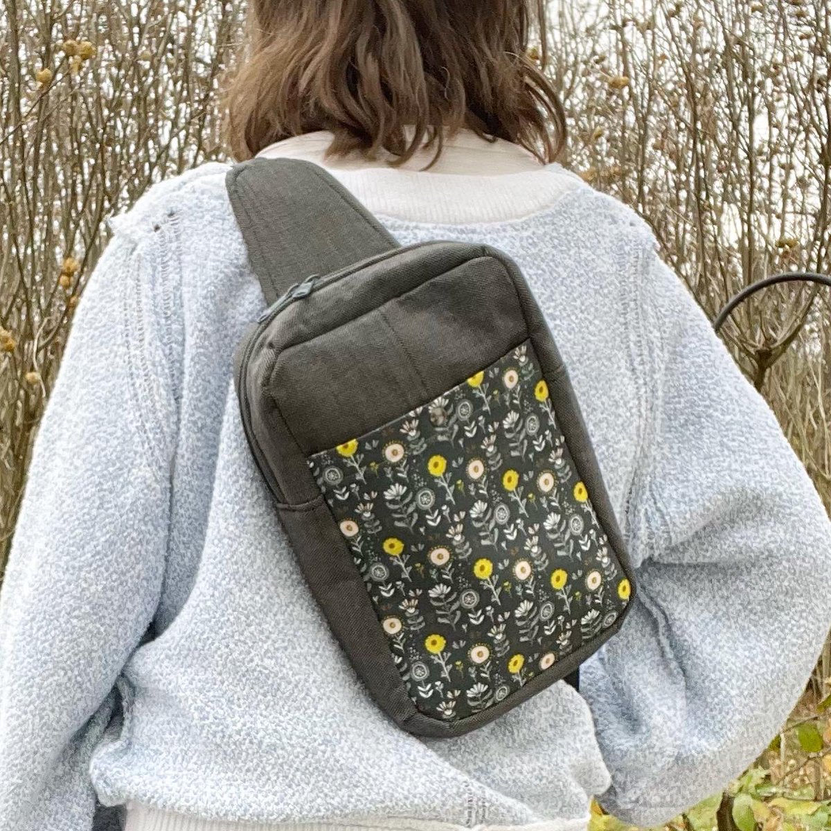 kuddlebumz's tweet photo. I made this from a suit jacket 🥰 and added a floral accent pocket! It can be worn front or back and it holds all the stuff. I love using mine for traveling or going to markets. Get yours at https://t.co/vrA1xC4keS 
.
.
.
.
#sandhillsling #slingbag #slingpurse #upcycledfashion https://t.co/hr7m1wlyod