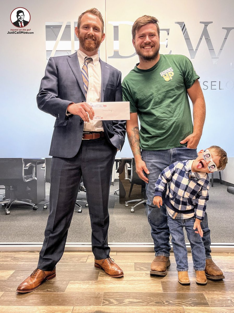 Cameron and his wife Jeranish were traveling through an intersection when a careless driver made a left hand turn in front of Cameron, causing a T-bone collision. They called Moe, and we settled their claim. When Cameron picked up his settlement check, his son got in the photo!