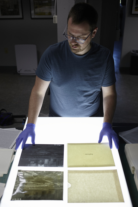 NEDCCInfo's tweet image. #Historicalcollections house an abundance of photographic negatives! Associate Collections Photographer Harrison Walker recently rehoused 844 polyester interpositives—positive images of negatives—depicting street scenes for a municipal archive. #WorkstationWednesday