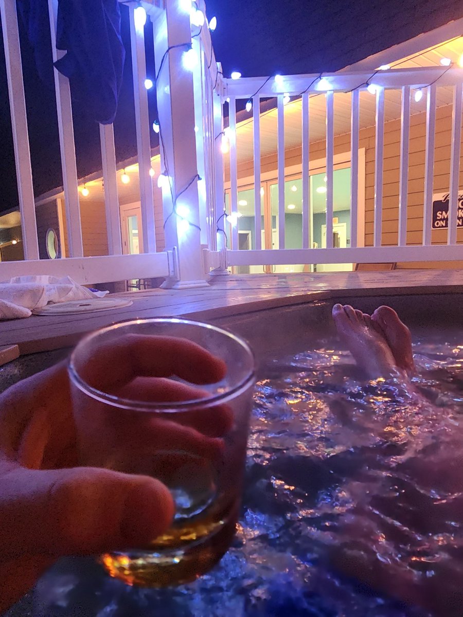 Enjoying two of the only things that Americans do better than Europeans: hot tubs and whiskey.