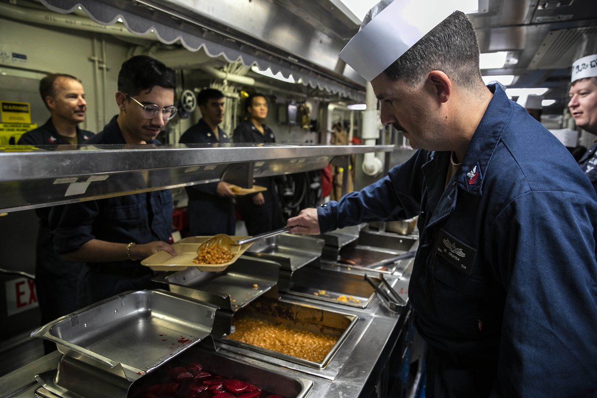 U.S. Navy Sailors serve food during a First Class Petty Officer Association event aboard Arleigh Burke-class guided-missile destroyer USS Sterett (DDG 104) during Annual Exercise (ANNUALEX) 2023.

#USNavy | #7thFleetBestFleet