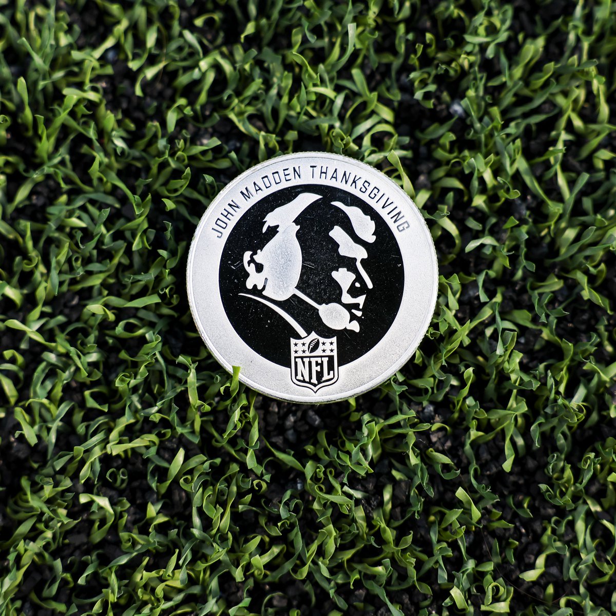 NFL's tweet image. In honor of #MaddenThanksgiving, a special coin featuring a silhouette of John Madden on one side (Heads) and a six-legged turducken on the reverse side (Tails) will be used for the coin toss before each Thanksgiving game.
