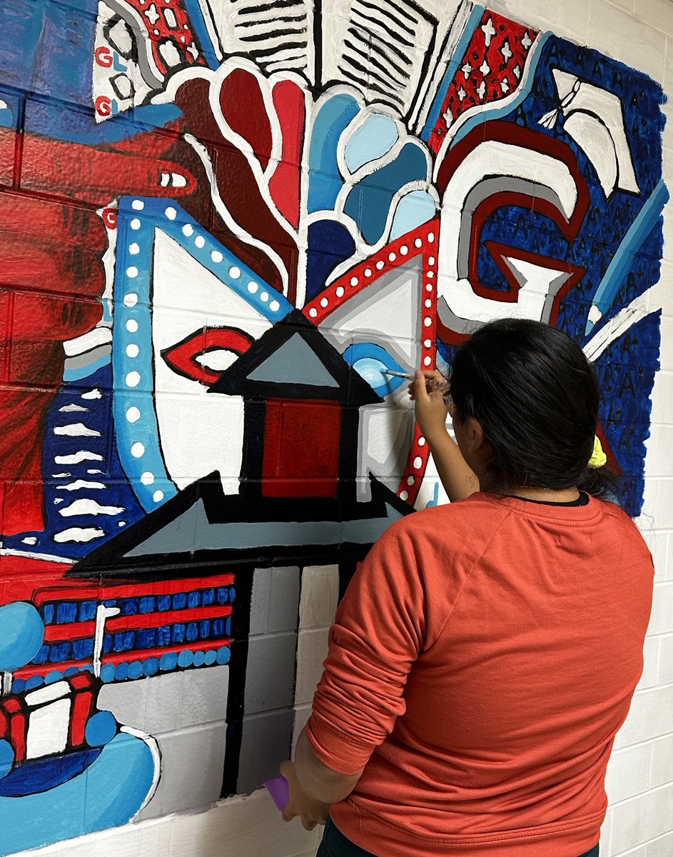 GLHSDeafProgram's tweet image. Senior Millie Romero working on her mural at the end of the foreign language wing. Looking good!!!