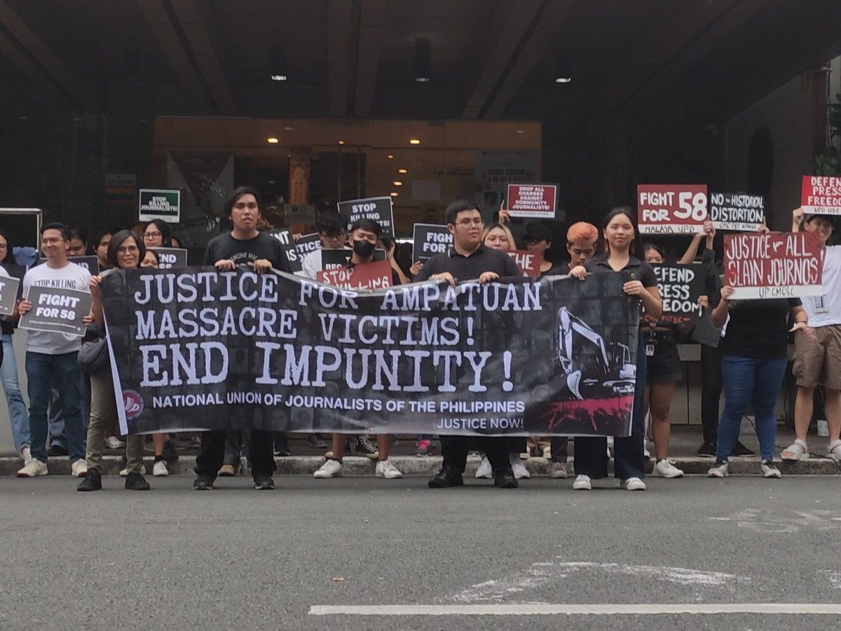 phkule's tweet photo. NOW: Students and press formations are here in front of the UP College of Mass Communication to commemorate the 14th anniversary of the Ampatuan Massacre, the kidnapping and killing of 32 journalists and 24 other individuals due to a political rivalry in Maguindanao. 

They call for justice for the victims, safety of journalists, and upholding press freedom in the country under the Marcos-Duterte regime.

#BreakFree2023
#DefendPressFreedom
#EndImpunity