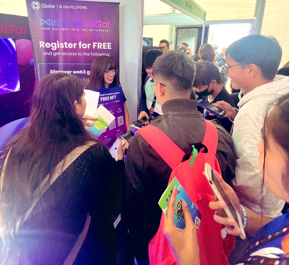 It's buzzing here at @YGGEvents! People are lining up and the excitement is palpable at the @metaversego_gg booth. Come join the fun and see why we're the hottest spot in the event! 🔥 #WhereTheActionIs