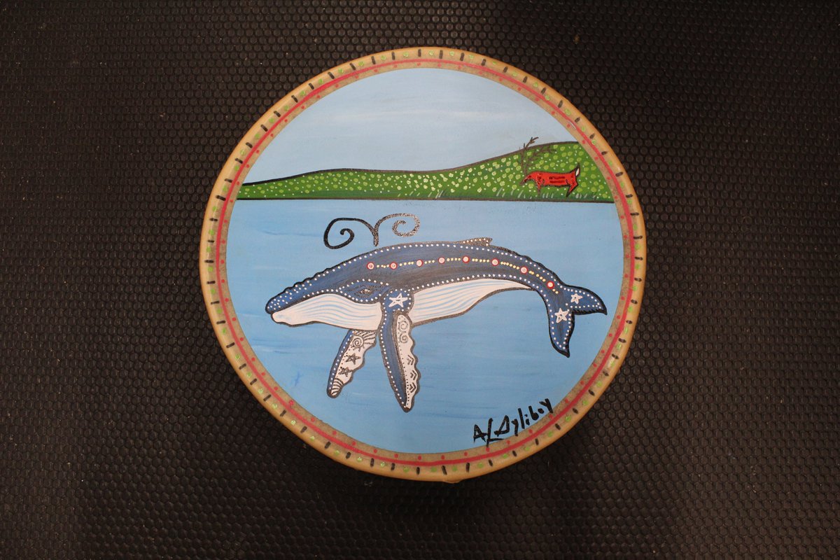 The Daily Drum
Today’s drum features the Whale with a Caribou.
The whale has been one of my favorite images to work with.  I painted many different species on canvas and of course on my drums. The caribou represented survival for the Mi’kmaq people.

Have a Great Day!