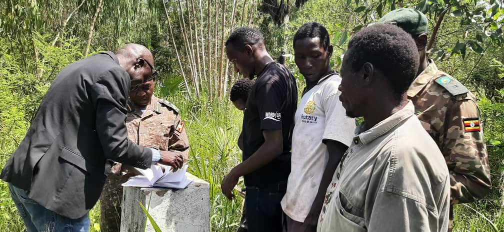 UWA Director for Conservation John Makombo with staff leading a team of Madi Okollo District leaders & community members on a boundary inspection of Ajai wildlife reserve in Ogoko Sub county. This was after a successful stakeholder engagement that was held at Ayavu.