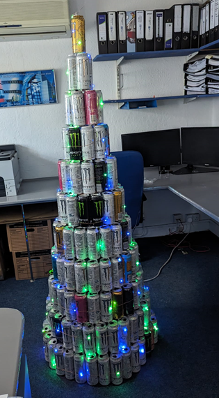 Pabbah's tweet photo. @MonsterEnergy To get our headquarters in the Festive disposition we have fashioned a Monster Xmas Tree from some spent cans.

 She is a thing of exquisiteness with her luminosities which really augment the heterogenous insignias.

Team Monster @ Blueprint Worcester UK https://t.co/x7ov4WnMju
