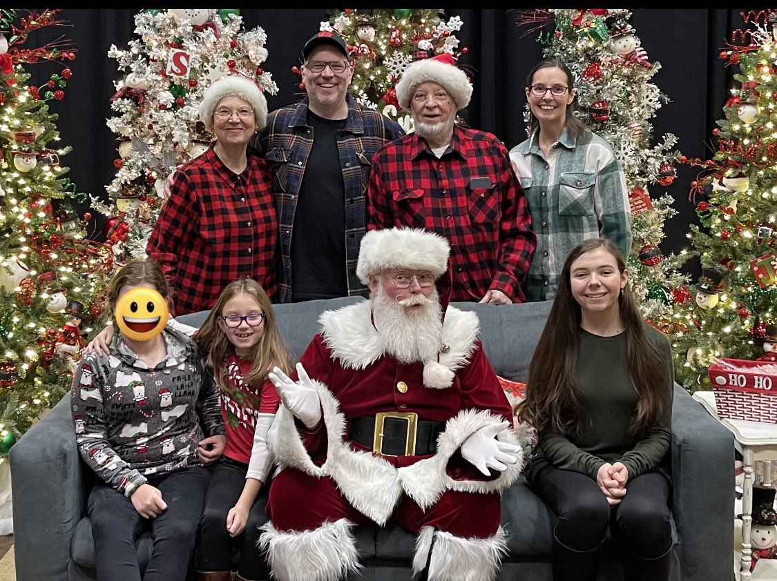 My 13 yr old niece decided she is too old to take a photo with Santa. I fixed it! #ThankfulForEmojis