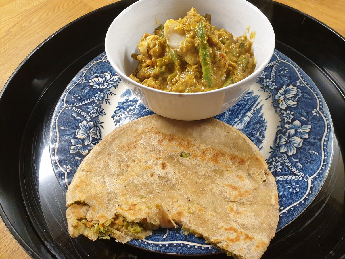 Home made keralan fish curry and veg stuffed paratha.
