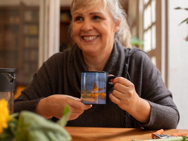 Introducing the limited edition #ChristmasNight coffee mug! 🎄✨ This serene color-changing ceramic mug captures the beauty of a mountain town Christmas. Get yours now before they're gone! #LimitedEdition #HolidayMug buff.ly/3SVxlye