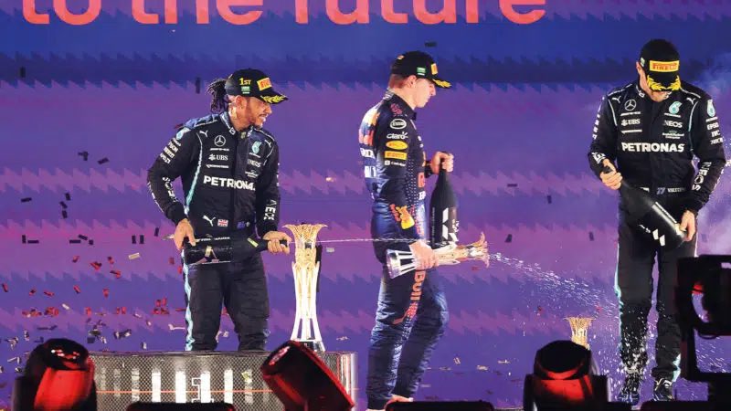 SLH44GOAT96's tweet photo. In the first picture we see Max walking off the podium after the Saudi GP in 2021 because he felt aggrieved over the 5s penalty… 

In the other pictures we see Lewis, a man who was just disgustingly manipulated out of his 8th championship… He not only congratulated Max as he was being interviewed… But he congratulated him in his own interview… Shook hands with Horner and celebrated with everyone on podium…

The difference between a child and a real champion was on full display in those final two GPs of 21 #AbuDhabiScandal