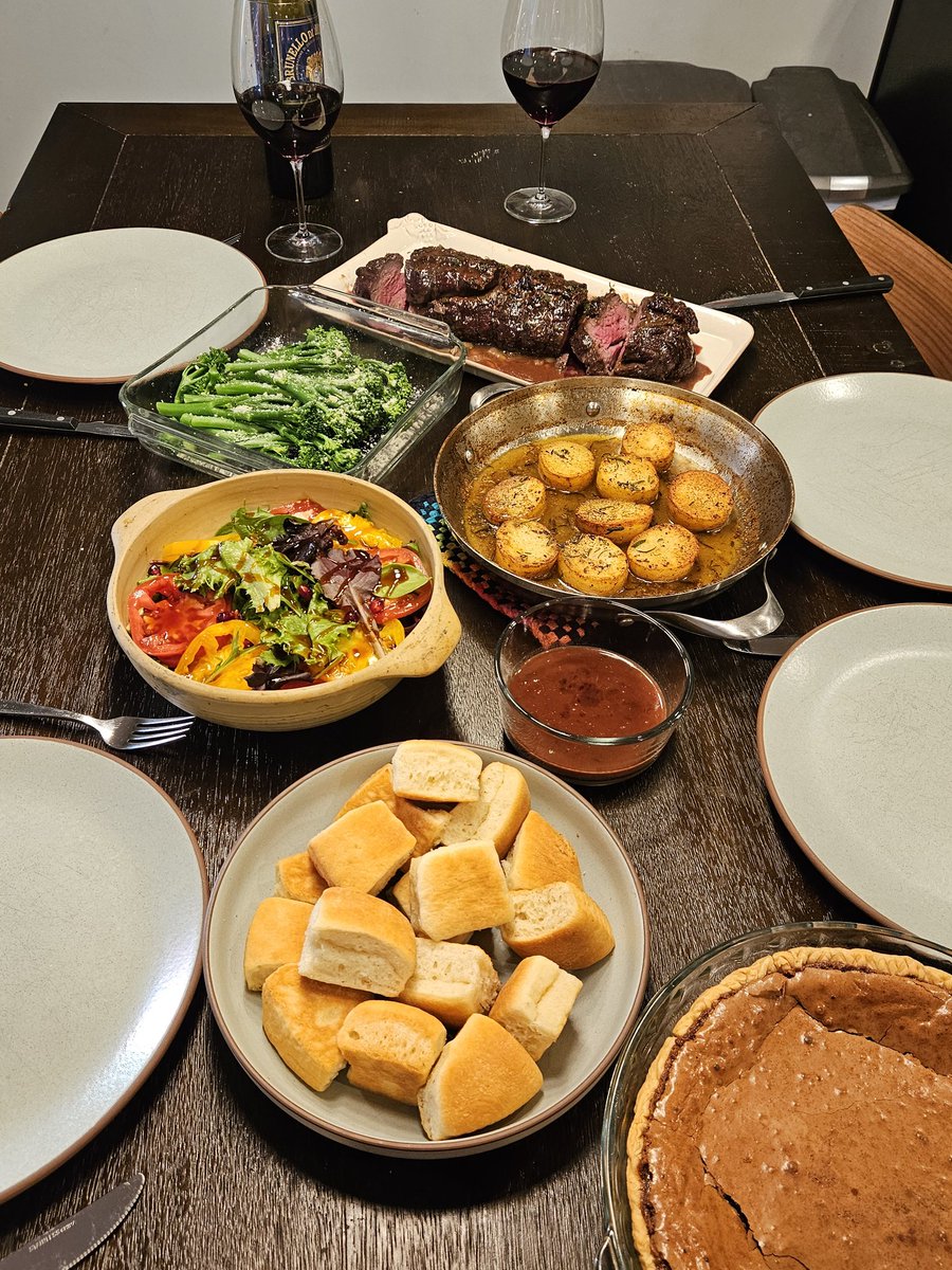 A Thanksigiving beef tenderloin in a red wine reduction, pan roasted potatoes, greens/tomato/pomegranate salad with a teriyaki dressing, yeast rolls (yes, they're store bought, not sorry), and chocolate chess pie.  Happy Thanksgiving! <a href="/ChefReactions/">Chef Reactions</a>
