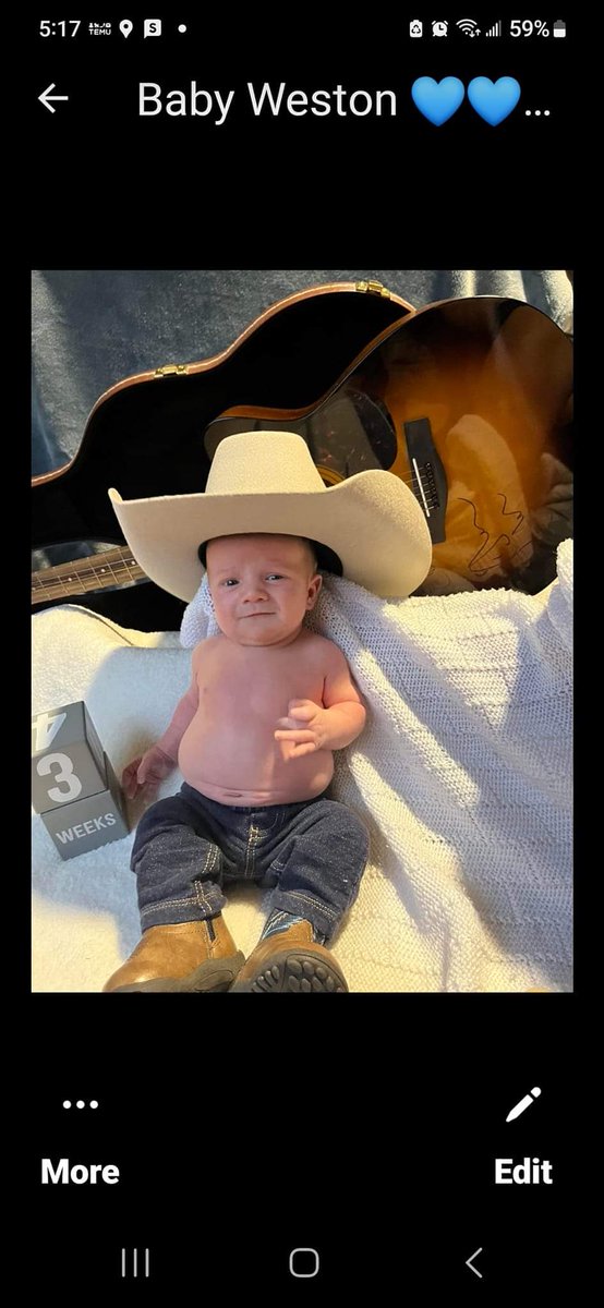 AUBBER's tweet photo. @KeithUrban Weston Keith reaneys photo shoot with his signed guitar. The baby boy who keith urban  did the gender reveal  and signed his guitar  and gave it to mom and dad to give baby boy. Concert in Moncton NB. https://t.co/EviVzI1pYs