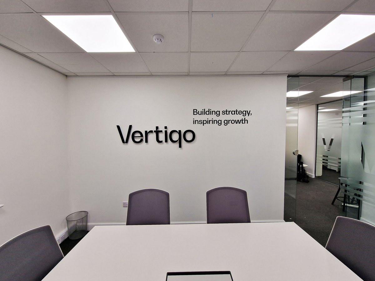 SXPeterborough's tweet image. Office wall sign for Vertiqo: Black acrylic lettering applied to wall via locator fixings.
Office windows fitted with privacy frosted vinyl showing the the background, with the letter V cut out in clear #officesigns #windowgraphics
