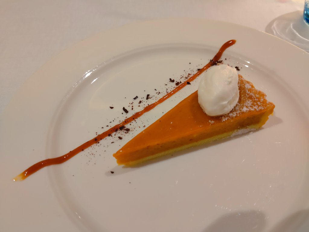 Thanksgiving dinner by Viking. Butternut squash soup (not pictured), Waldorf salad, roast turkey and gravy, green beans, "pumpkin mash," bread dressing (or stuffing) that looked like a crab cake but tasted like it should, and pumpkin pie. All quite good.