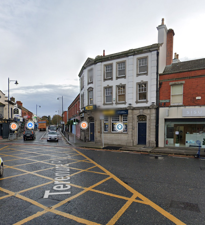 Among the false images circulating last night the eagle eyed among  you may have noticed that this photo of the army on Parnell Street was in fact of a Victorian building housing Doyle's offices with a nice chamfered corner in Terenure from a few years back