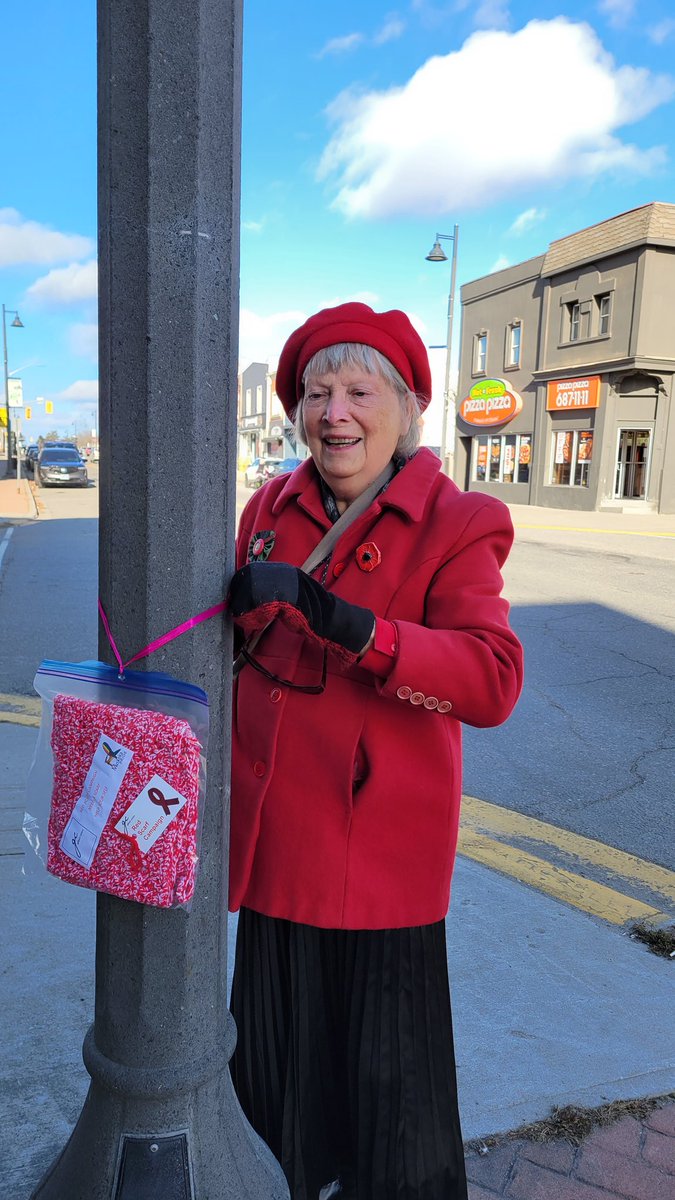 muskokapride's tweet photo. Community members, volunteers from #MuskokaPride, and Kellie from the @gilbertcentre tied red scarves to lampposts in downtown #Gravenhurst and #Huntsville today in recognition of #WorldAIDSDay on December 1st and #HIVawareness. Need a scarf? Take a scarf! #RedScarfCampaign https://t.co/pjkW84ez3z