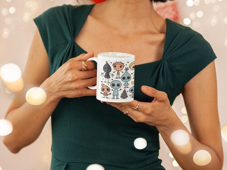 Get in the festive spirit with this adorable Cute Aliens Decorative Christmas Coffee Mug! Made of white ceramic and holding 11 oz, it's the perfect size for your favorite hot beverages. #ChristmasMug #FestiveVibes buff.ly/3MYX4lu