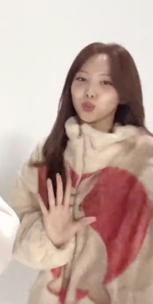 nayeon wearing the rabbit heart fur jacket from kater