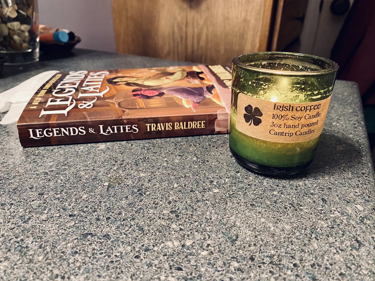 Lighting my Irish Coffee candle from <a href="/CantripCandles/">Cantrip Candles</a> while reading Legends &amp; Lattes just makes sense.