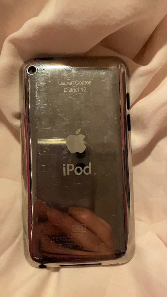 mom uncovered an ancient relic today: my middle school ipod that i had engraved with my name and “district 12” 😭
