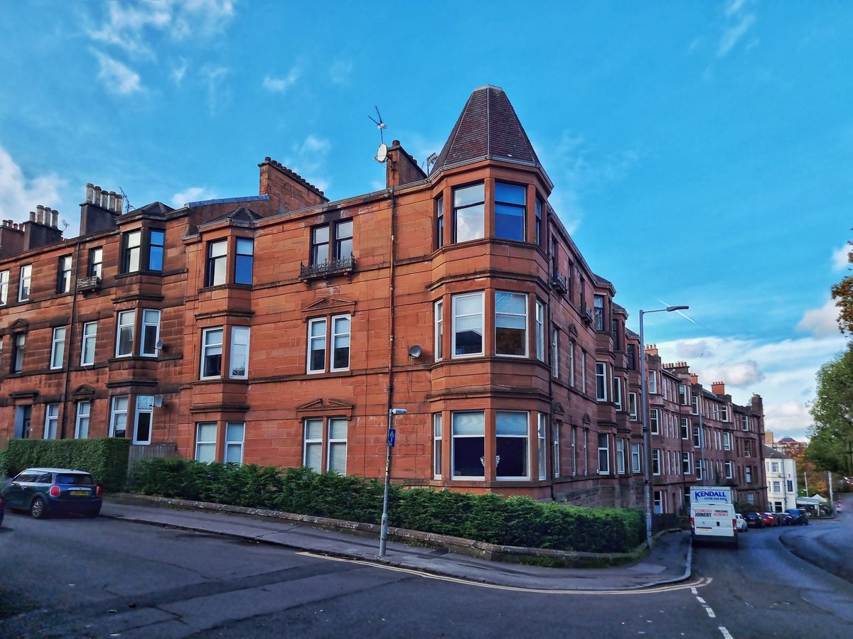 Tenement typologies of the south side part 5.  Three storey red sandstone with a pokey hat, built on falling ground at the corner of Langside Ave and Mansionhouse Rd early c20th.