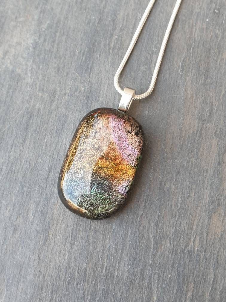 Amazing colours within this unique handcrafted dichroic glass necklace. Perfect for the autumn and winter season. #handmade #giftideas #shopindie #etsy #etsyuk #christmas buff.ly/40LbA68